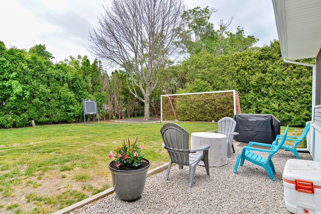 237 Kaufman Road Somerset, MA 02726 - Photo 38 of 38 a view of a chairs and table in the backyard