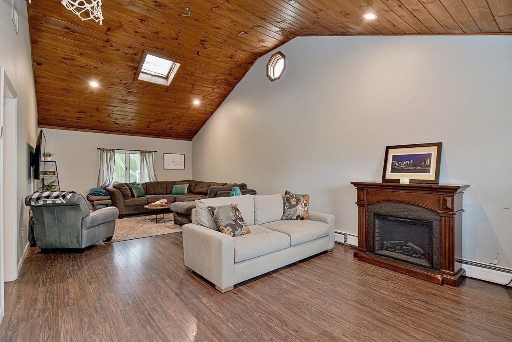 237 Kaufman Road Somerset, MA 02726 - Photo 8 of 38 a living room with furniture and a fireplace