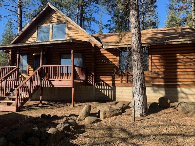 20394 Camas Road Burney, CA 96013 - Photo 1 of 56 a view of a house with a wooden fence