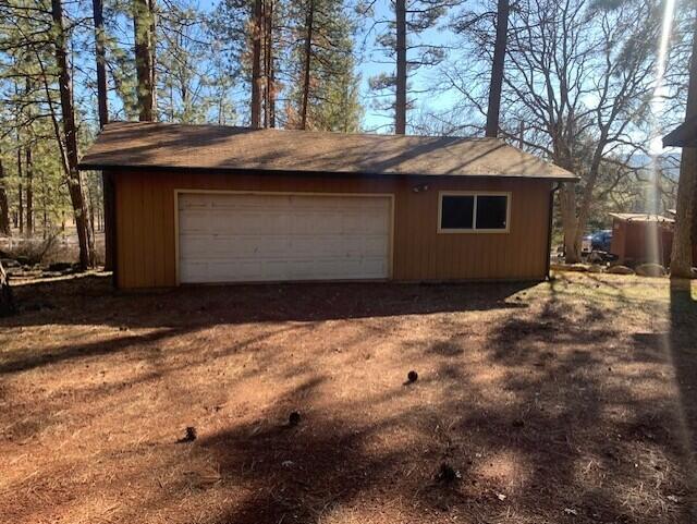 20394 Camas Road Burney, CA 96013 - Photo 17 of 56 a front view of a house with a yard