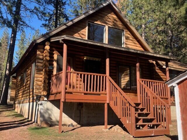 20394 Camas Road Burney, CA 96013 - Photo 2 of 56 a view of a house with wooden fence