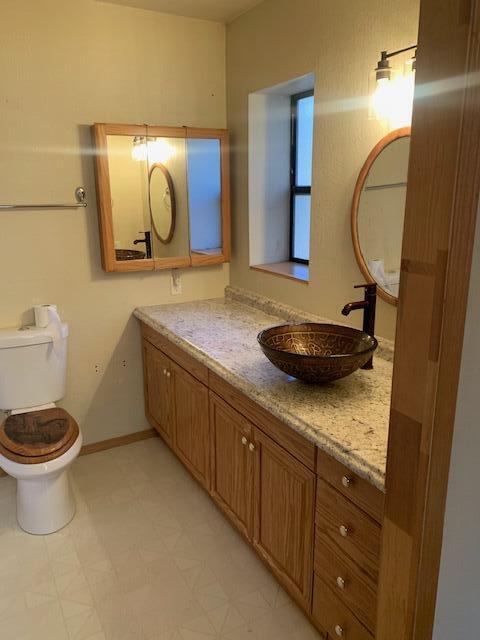 20394 Camas Road Burney, CA 96013 - Photo 27 of 56 a bathroom with a granite countertop sink and a mirror