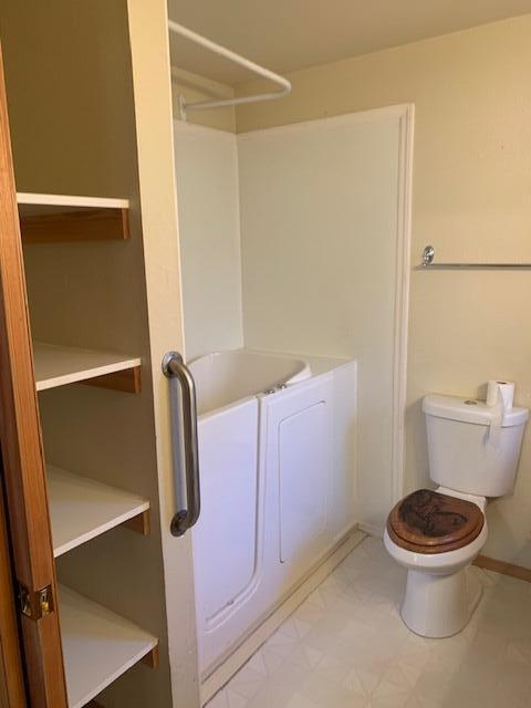 20394 Camas Road Burney, CA 96013 - Photo 28 of 56 a white toilet sitting next to a shower