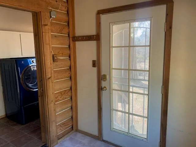 a view of a room with wooden floor and windows