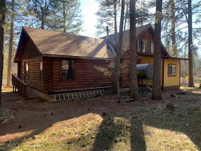 20394 Camas Road Burney, CA 96013 - Photo 45 of 56 a view of a house with a yard