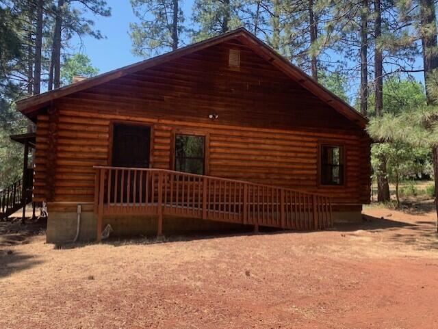 20394 Camas Road Burney, CA 96013 - Photo 6 of 56 a backyard of a house with a yard