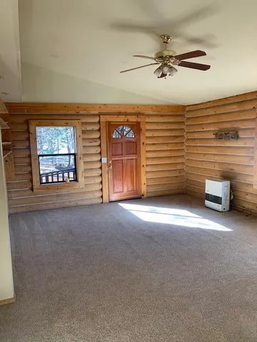 a front view of a house with large windows