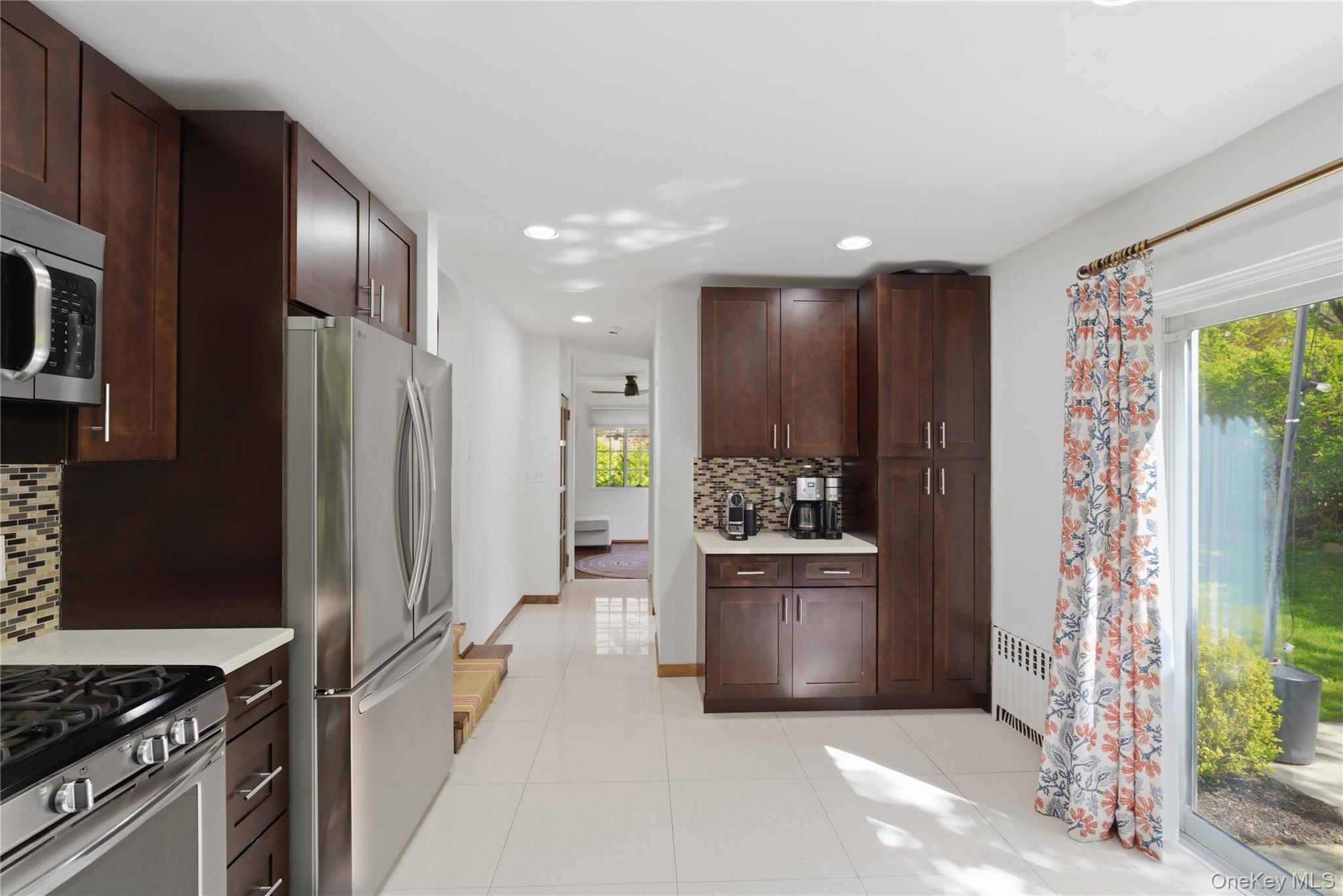 15 Kingsbury Road New Rochelle, NY 10804 - Photo 12 of 30 a kitchen with a refrigerator and a stove top oven