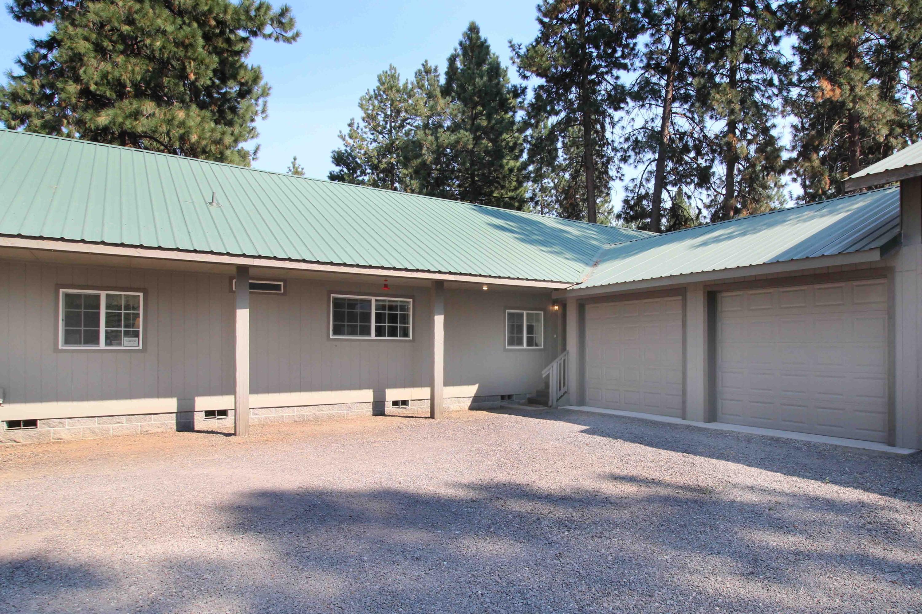 60076 Turquoise Road Bend, OR 97702 - Photo 16 of 43 Front of home, standing seam ramada over home, garage