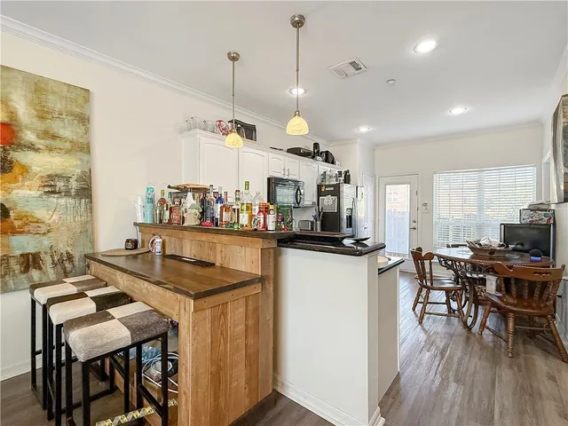 a kitchen with a table and chairs in it