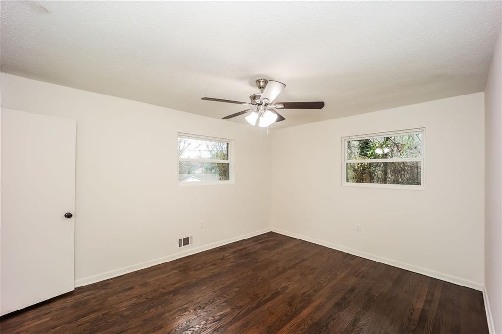 5726 Southwick Court Southwest Atlanta, GA 30349 - Photo 17 of 32 a view of a big room with wooden floor and windows
