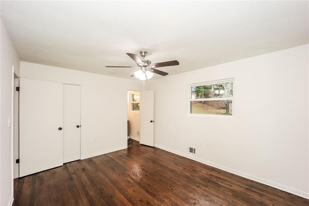 5726 Southwick Court Southwest Atlanta, GA 30349 - Photo 19 of 31 a view of a room with wooden floor