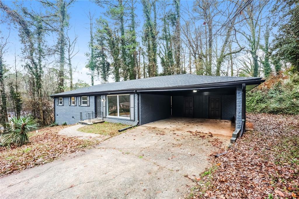 5726 Southwick Court Southwest Atlanta, GA 30349 - Photo 2 of 31 a view of house with a outdoor space