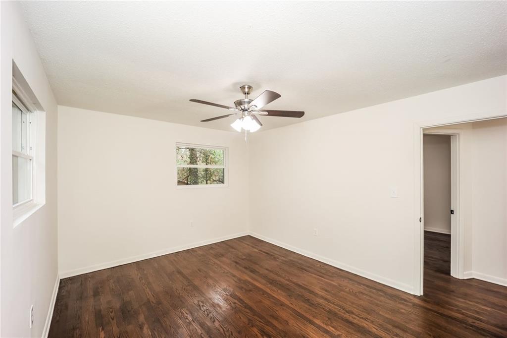 5726 Southwick Court Southwest Atlanta, GA 30349 - Photo 21 of 31 a view of a big room with wooden floor
