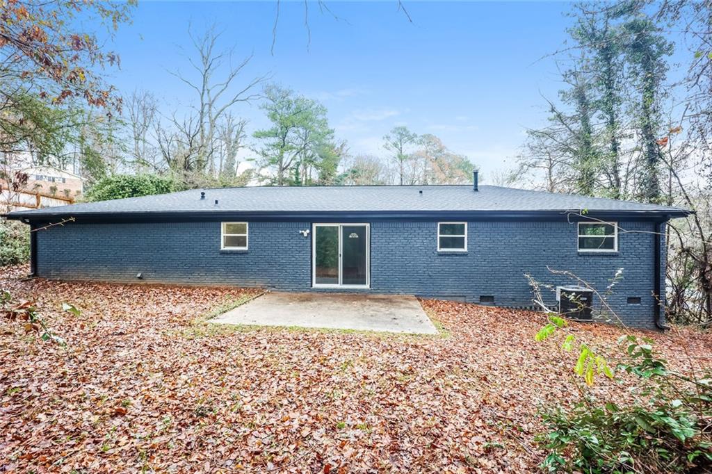 5726 Southwick Court Southwest Atlanta, GA 30349 - Photo 29 of 32 a house that has tree in front of it