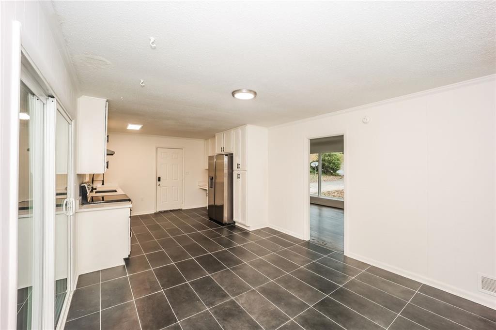 5726 Southwick Court Southwest Atlanta, GA 30349 - Photo 10 of 31 a view of a kitchen with a sink