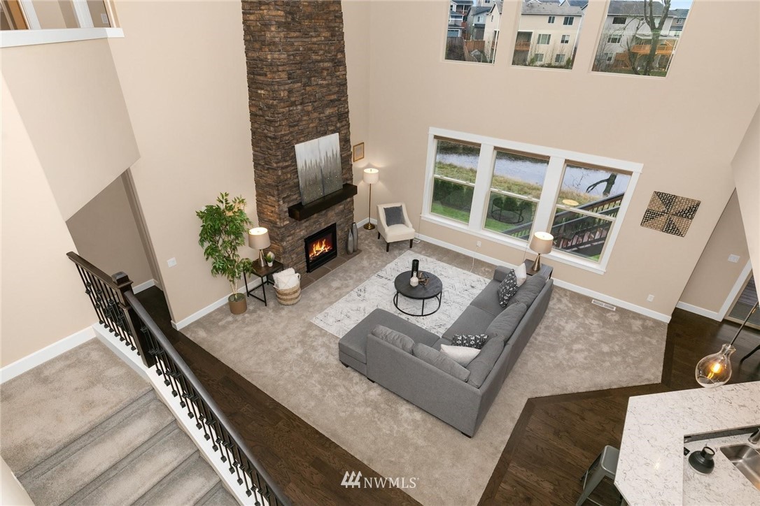 25619 209th Loop Southeast Covington, WA 98042 - Photo 22 of 37 a living room with furniture and a flat screen tv