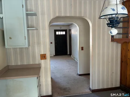 an entryway with a chandelier