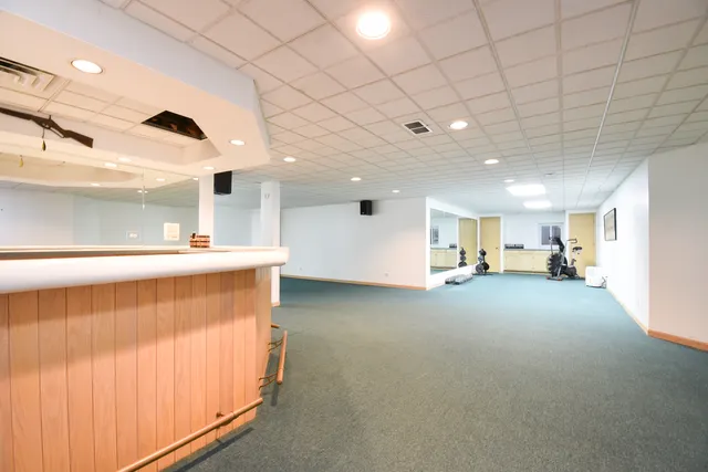 a roof deck with a table and chairs