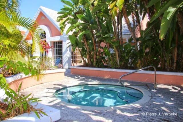 1000 Crystal Way, Unit C Delray Beach, FL 33444 - Photo 10 of 10 a swimming pool with an outdoor space and seating area