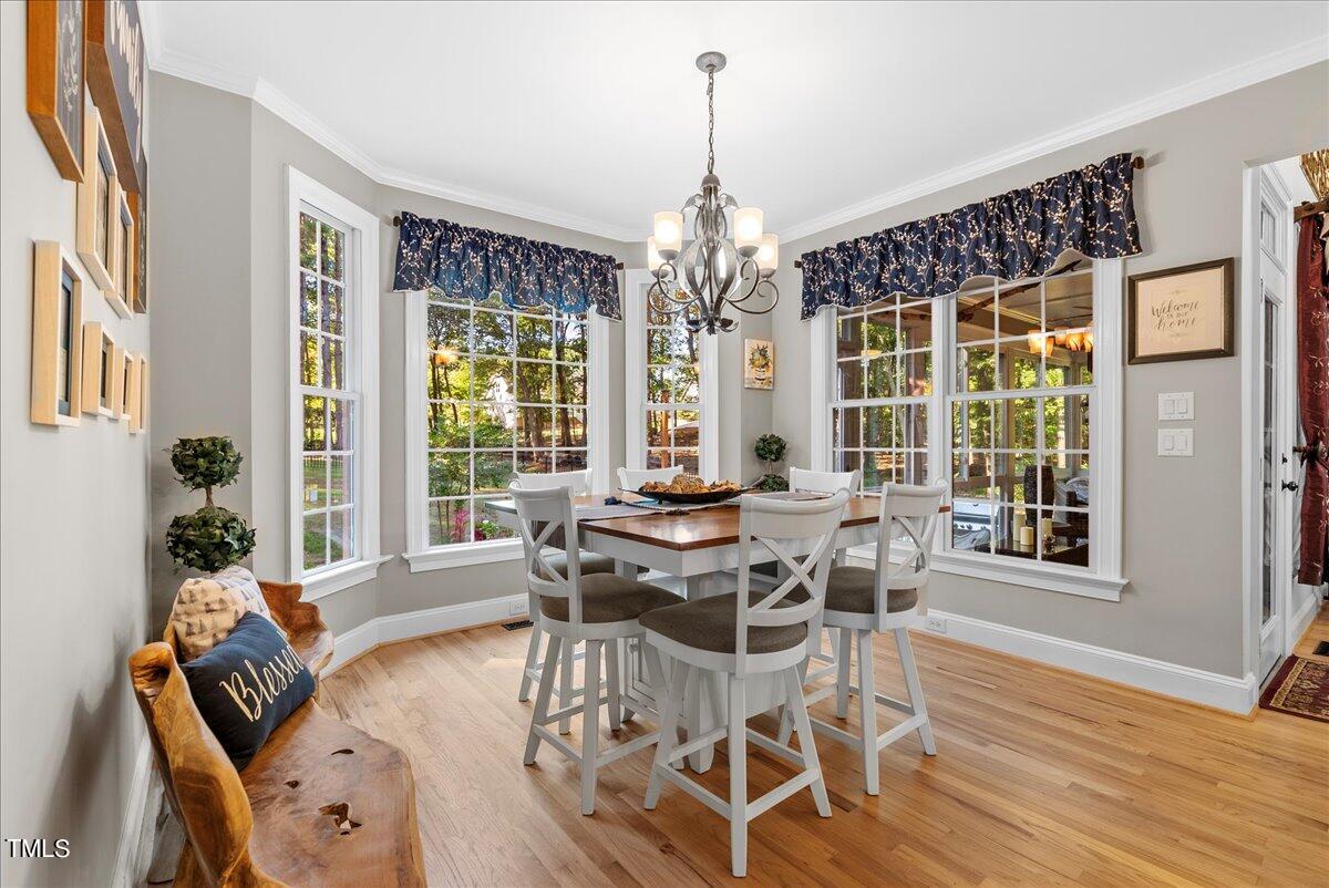 105 Jackson Road Youngsville, NC 27596 - Photo 11 of 55 a view of a dining room with furniture window and outside view