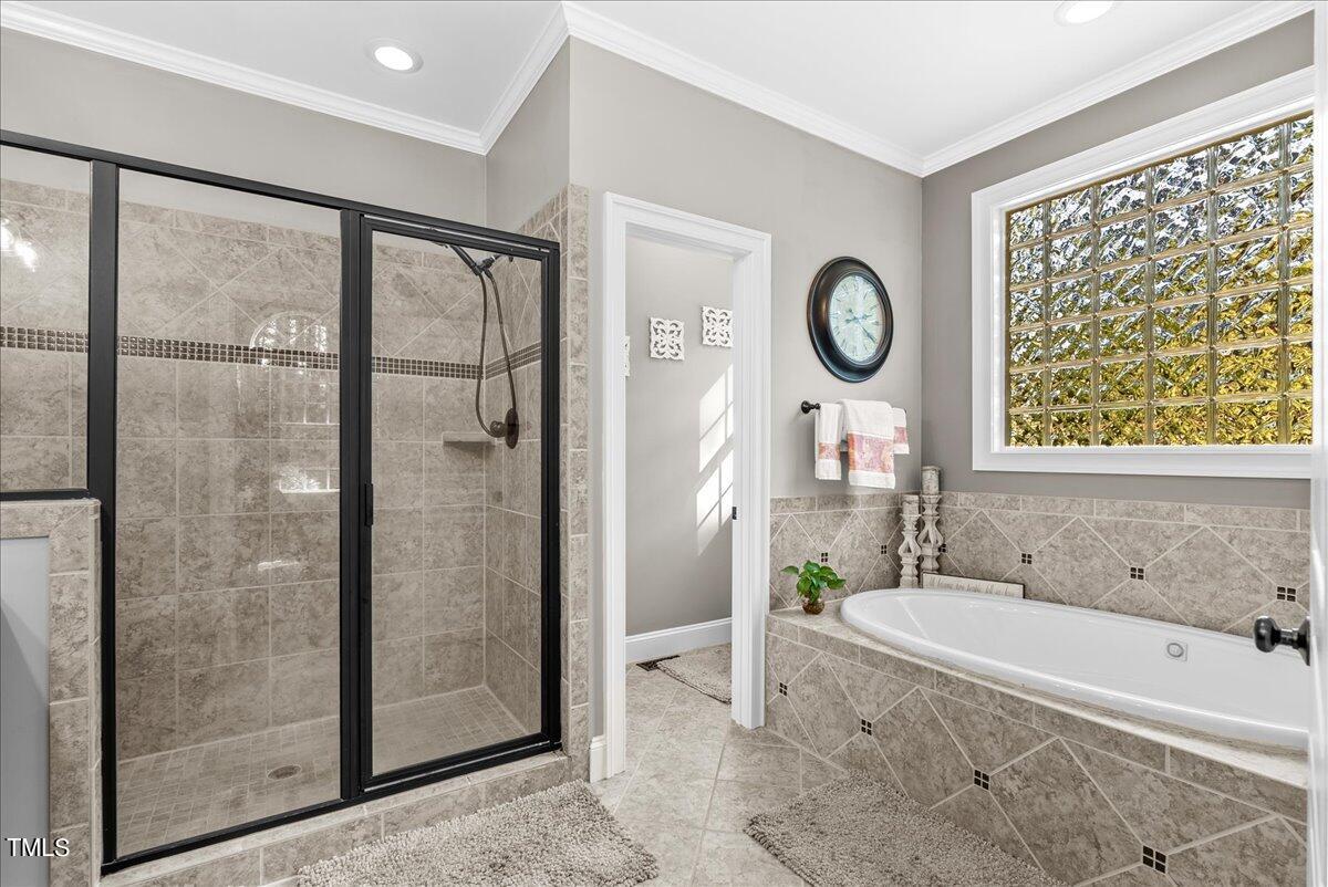105 Jackson Road Youngsville, NC 27596 - Photo 24 of 55 a bathroom with a granite countertop sink a mirror and a bathtub