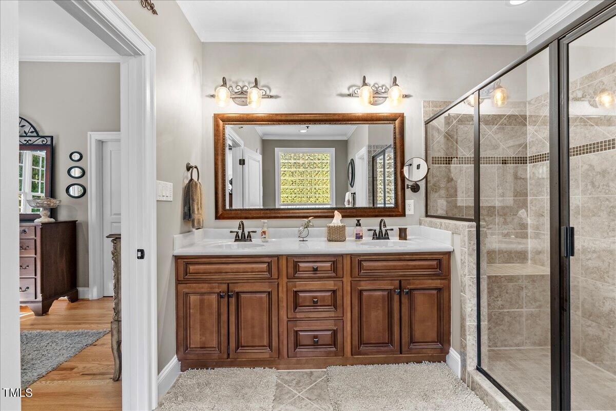 105 Jackson Road Youngsville, NC 27596 - Photo 25 of 55 a bathroom with a double vanity sink and a mirror