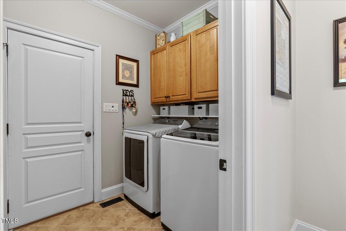 105 Jackson Road Youngsville, NC 27596 - Photo 27 of 55 a view of a storage and utility room with washer and dryer