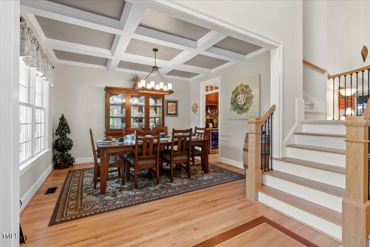 105 Jackson Road Youngsville, NC 27596 - Photo 30 of 55 a view of a dining room with lots of furniture and wooden floor