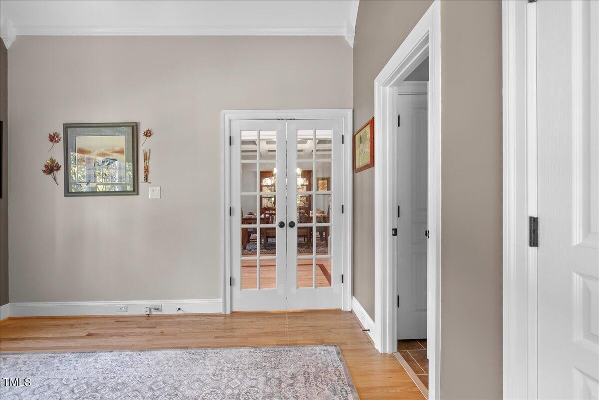 105 Jackson Road Youngsville, NC 27596 - Photo 32 of 55 a view of a hallway with wooden floor and a living room