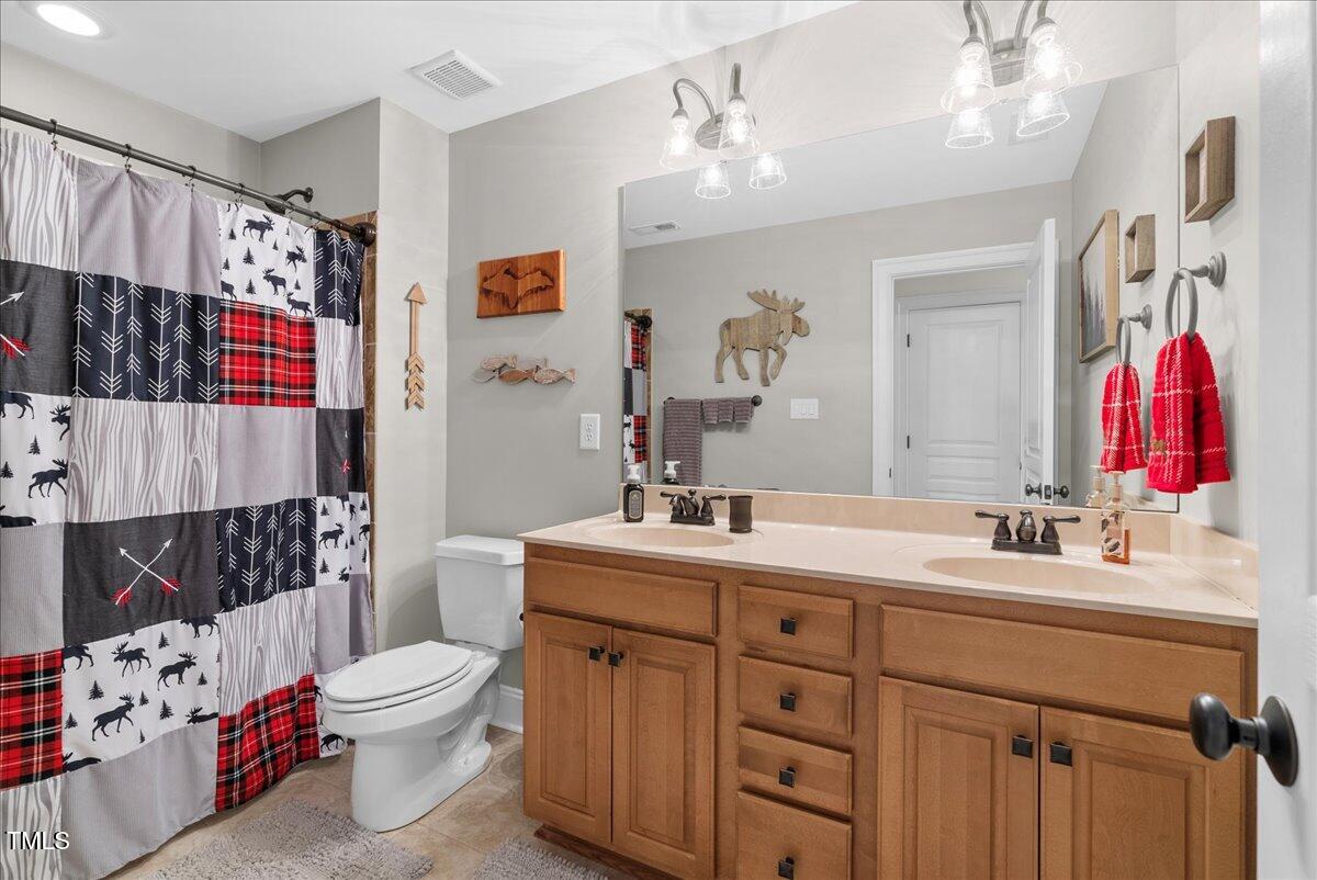 105 Jackson Road Youngsville, NC 27596 - Photo 35 of 55 a bathroom with a sink toilet tub and shower