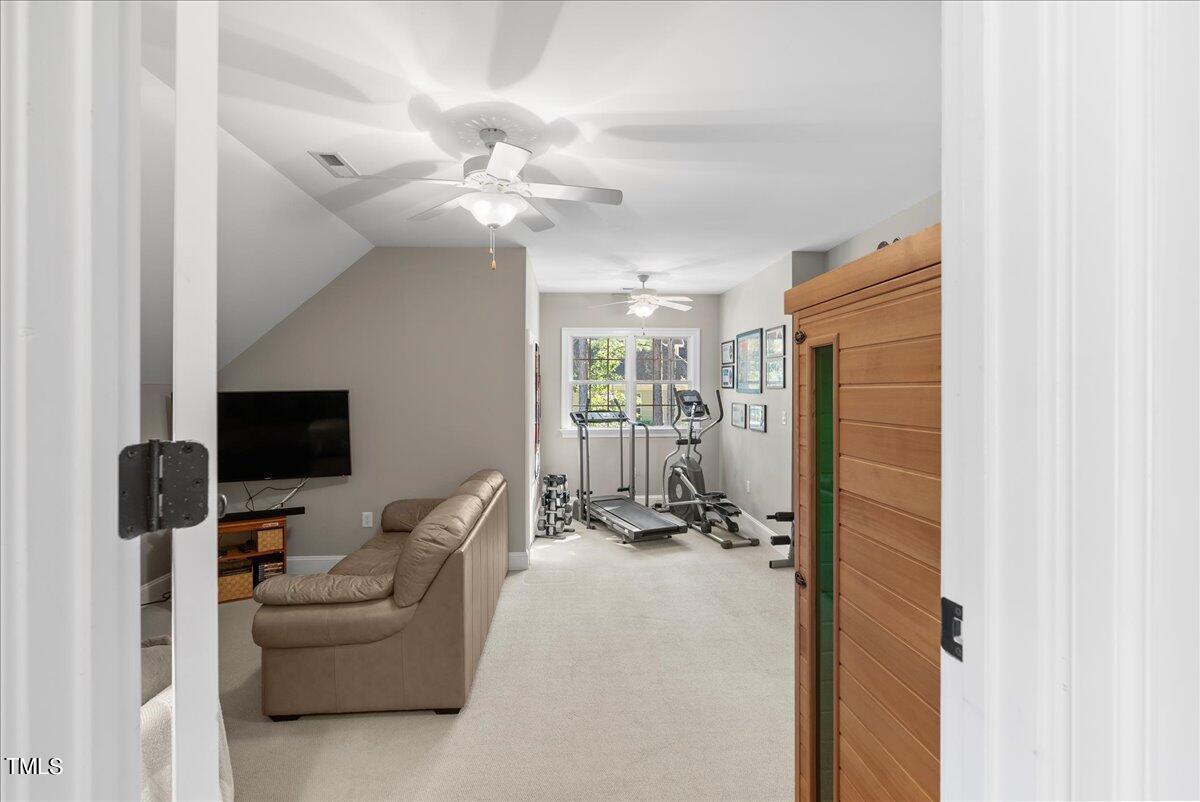105 Jackson Road Youngsville, NC 27596 - Photo 37 of 55 a view of a livingroom with a couch and a flat screen tv
