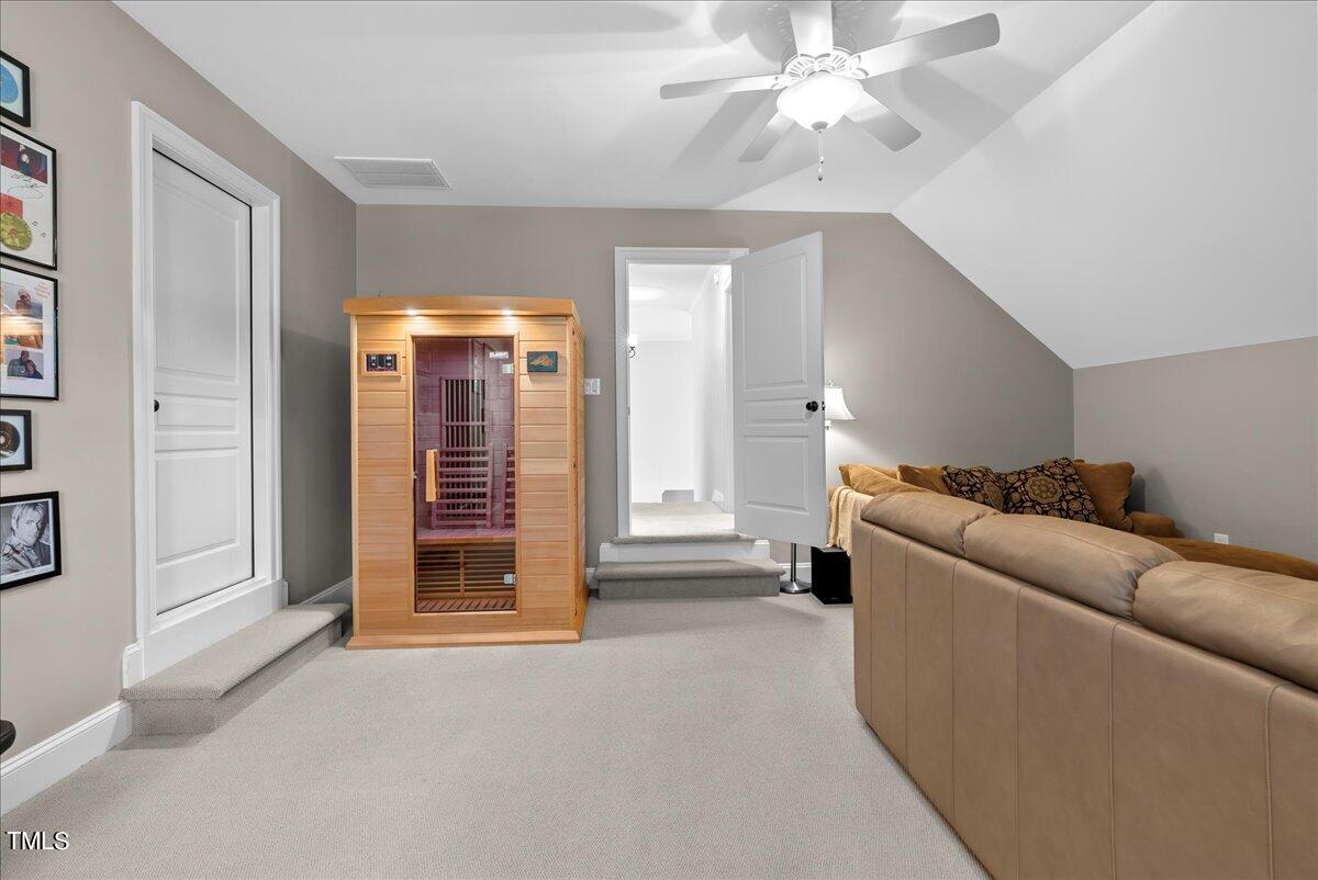 105 Jackson Road Youngsville, NC 27596 - Photo 38 of 55 a living room with furniture and a ceiling fan