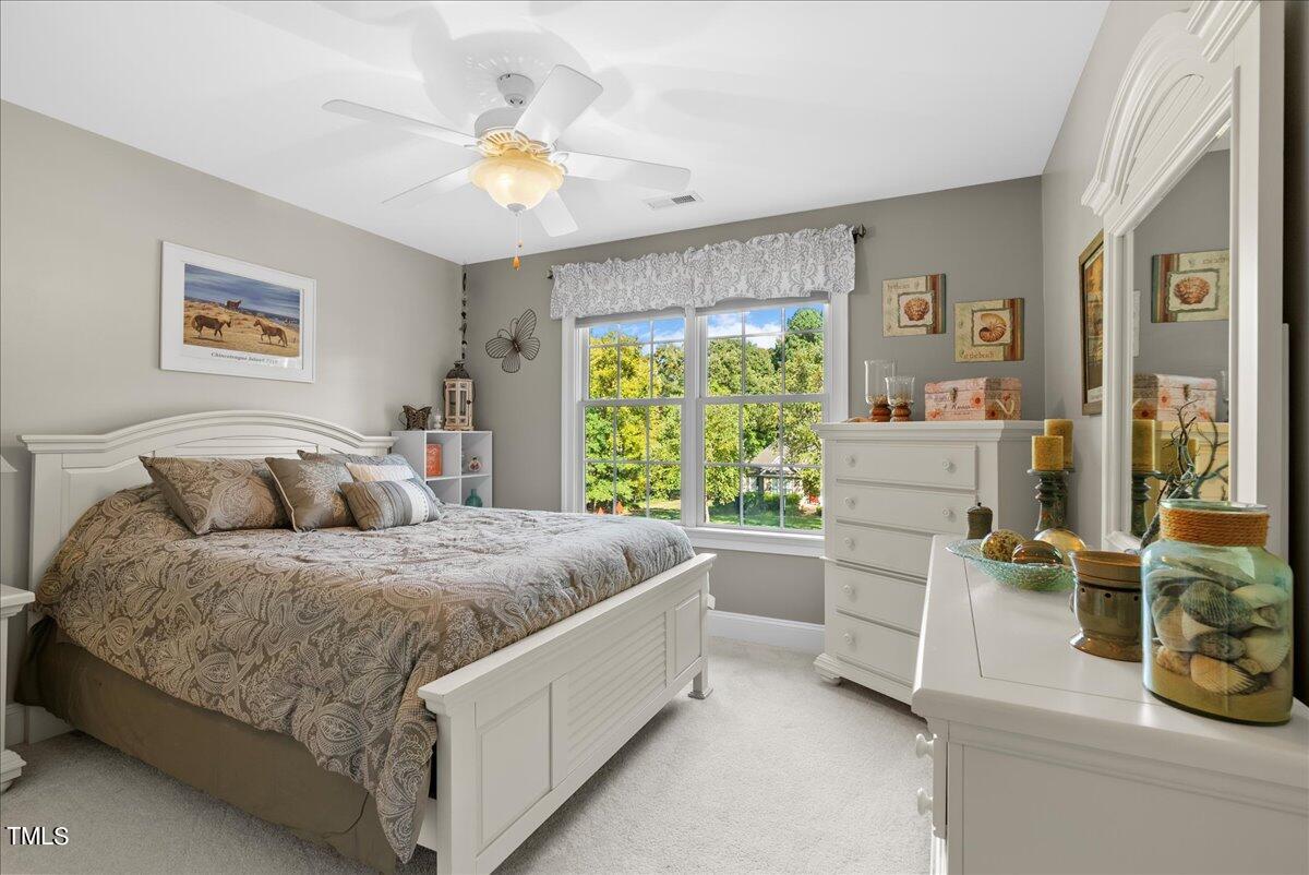 105 Jackson Road Youngsville, NC 27596 - Photo 40 of 55 a room with a bed and a table