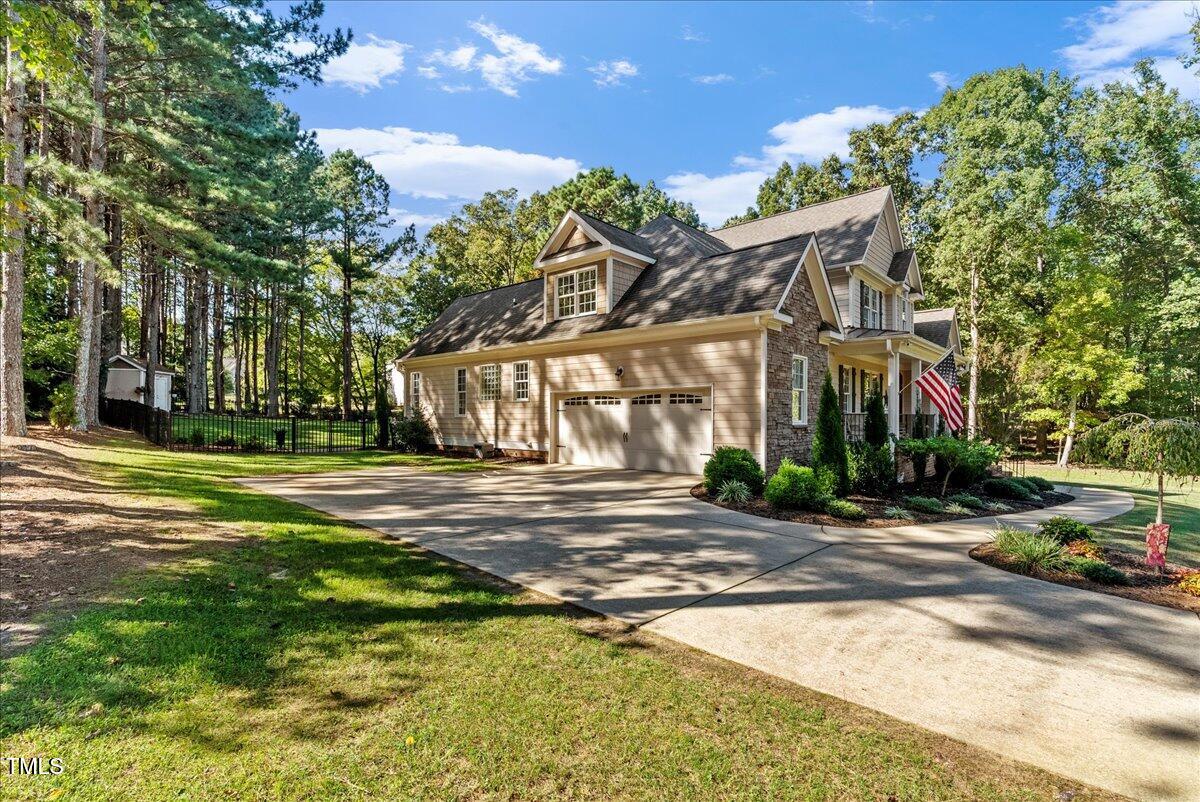 105 Jackson Road Youngsville, NC 27596 - Photo 43 of 55 a view of a building with a yard