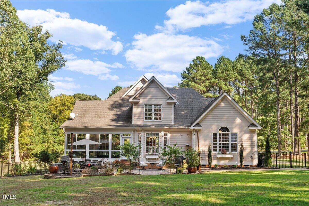 105 Jackson Road Youngsville, NC 27596 - Photo 52 of 55 front view of a house with a garden