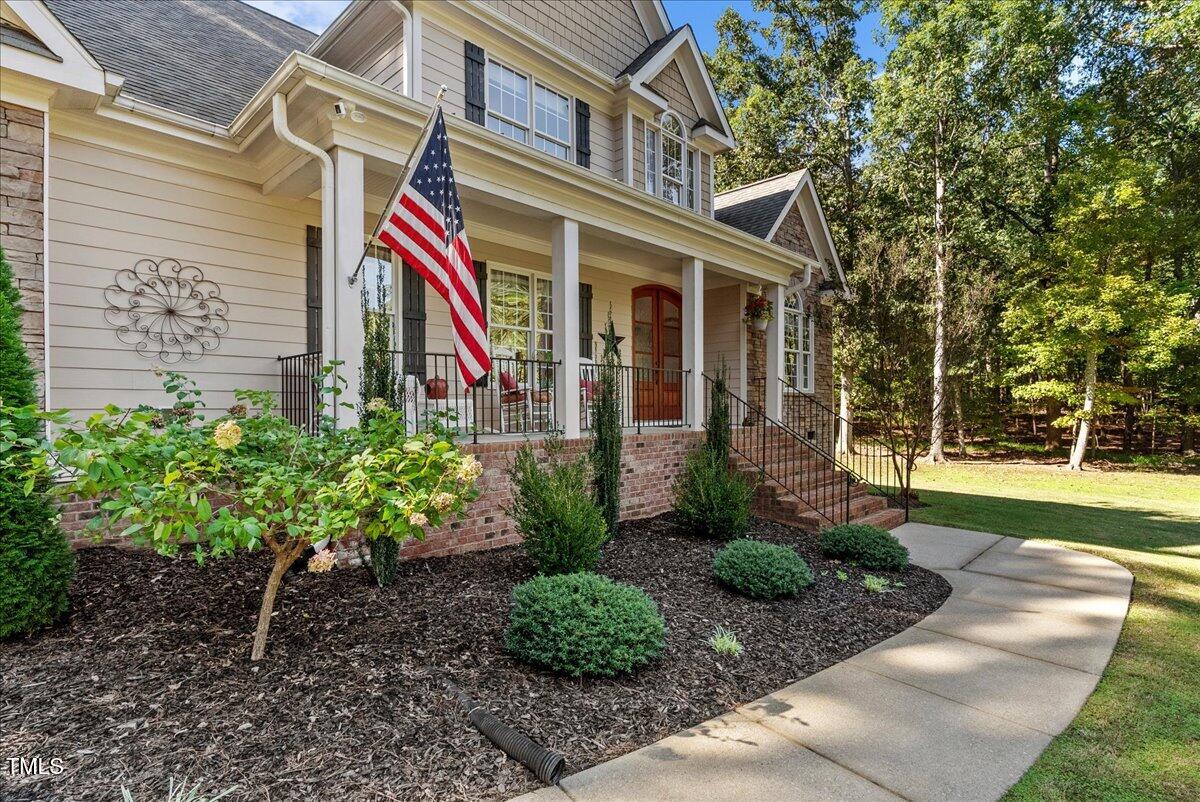 105 Jackson Road Youngsville, NC 27596 - Photo 53 of 55 a front view of a house with garden