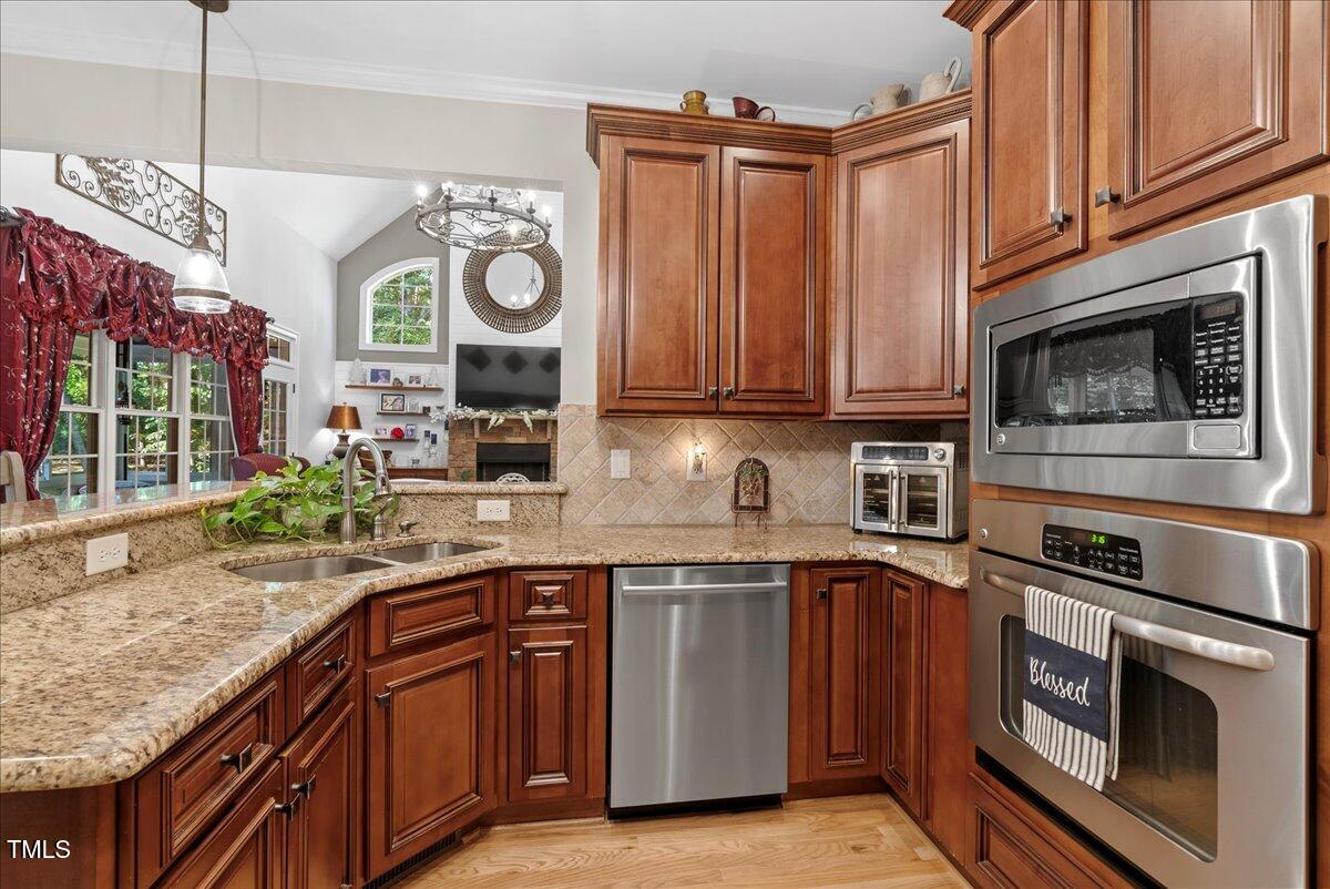 105 Jackson Road Youngsville, NC 27596 - Photo 6 of 55 a kitchen with stainless steel appliances granite countertop a sink a stove and cabinets
