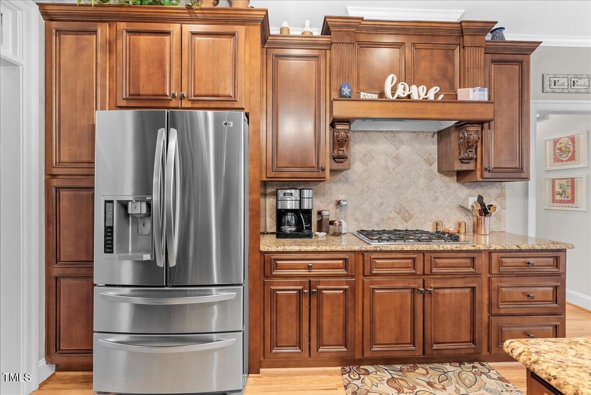105 Jackson Road Youngsville, NC 27596 - Photo 8 of 55 a kitchen with stainless steel appliances granite countertop a refrigerator and a stove