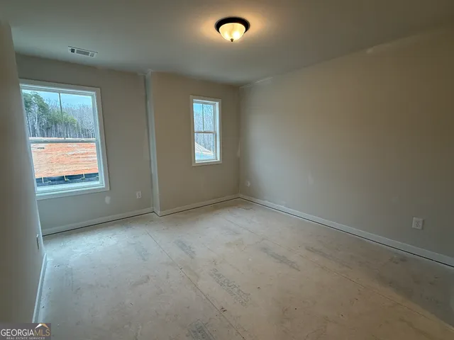 an empty room with windows