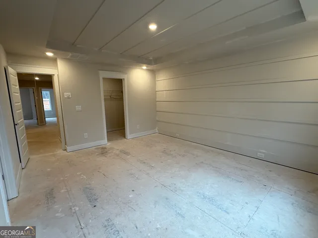 an empty room with a bathroom