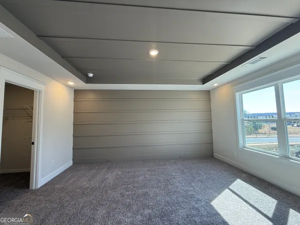 a view of an empty room with windows