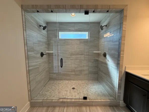 a bathroom with a sink and shower