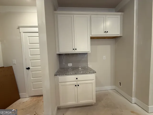 a view of cabinets and wooden floor