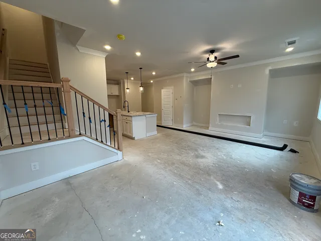 a view of a hallway with stairs