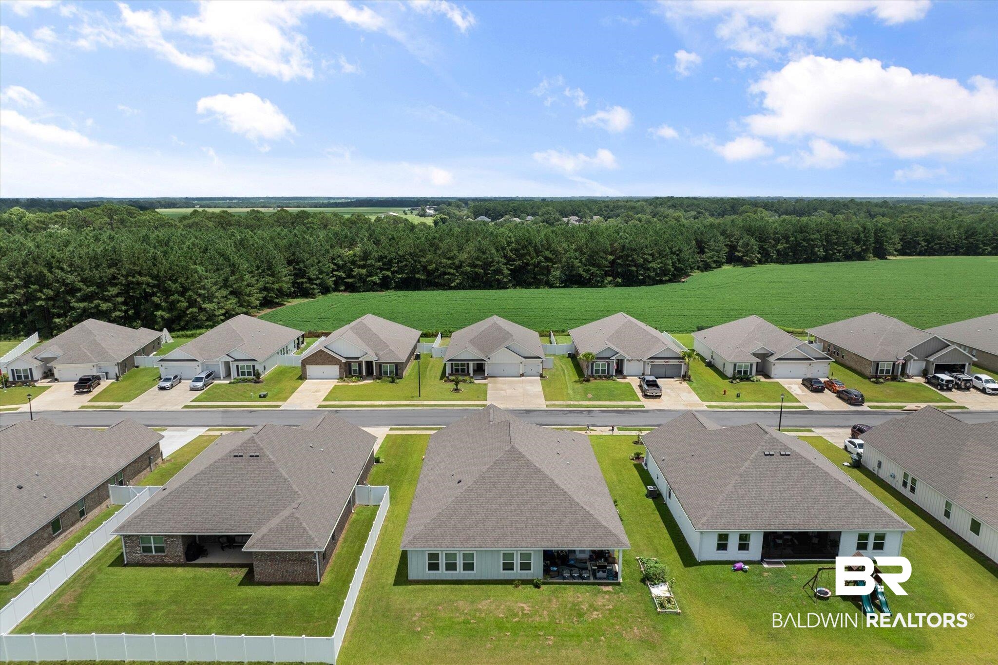 11229 Genuine Risk Circle Daphne, AL 36526 - Photo 36 of 46 Aerial view of residential area with a heavily wooded area