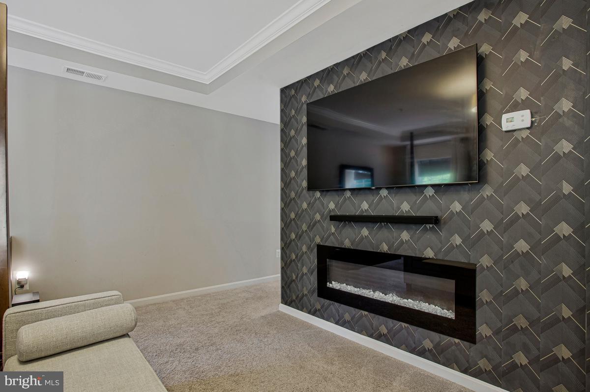 8704 Alexa Road Clinton, MD 20735 - Photo 29 of 42 Modern fireplace adds warmth and style