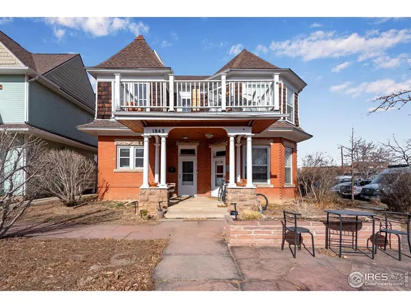 a front view of a house with a yard outdoor seating and kitchen view