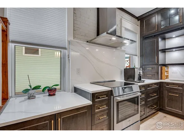 a kitchen with a cabinets and stove