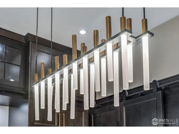 a kitchen with a refrigerator and a stove